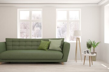 White living room with sofa and winter landscape in window. Scandinavian interior design. 3D illustration
