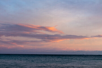 beautiful sea with waves, foam, beach at sunset against the sky with clouds on a nice evening in travel, walking, vacation, tourism, travel, holiday