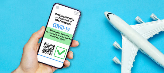 Coronavirus vaccination certificate or vaccine passport for travellers concept. COVID-19 immunity e-passport in the smartphone mobile app for international travelling.