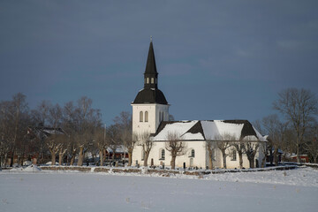 Fototapeta na wymiar Winter view over Skå church on the Drottningholm island in Stockholm