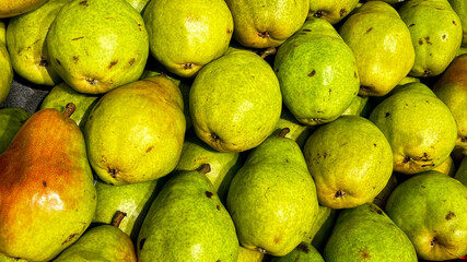 A display of bright green pears