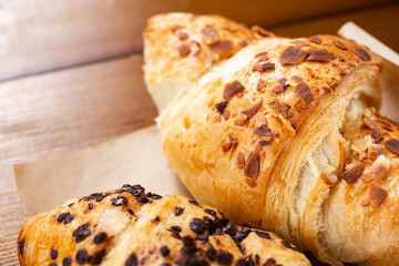 set of fresh baked croissants on wooden table. French croissant.