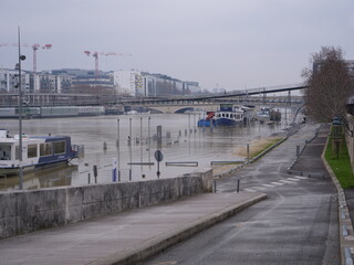 Fototapeta na wymiar The Seine river during floods during winter.