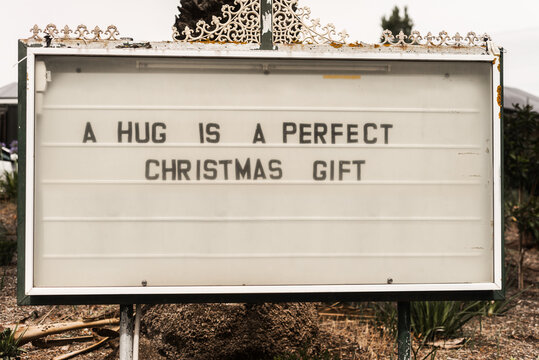 church sign reading: a hug is a perfect christmas gift