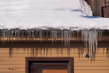 icicles hanging from the roof, in winter