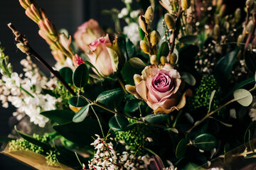 Wedding flowers bloom, bridal bouquet closeup. Decoration made of roses, peonies and decorative plants, close-up, selective focus, nobody, objects