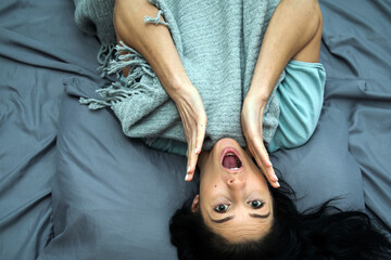 Beautiful woman smiling in bed, close up
