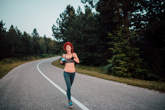 Young attractive woman running outdoor