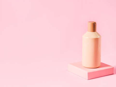 Geometric Stand Podium Displaying Cosmetic Skin Body Care Generic Bottle On Pink Background. Hair Product, Shampoo, Body Lotion