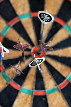 Detailed View Of Darts In A Vintage Dartboard