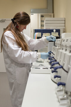 Female scientist on a laboratory of genetic research with a DNA chip