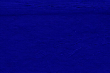 Cardboard blue abstract pattern texture close-up. Retro old paper background. Grunge concrete wall. Vintage blank wallpaper.