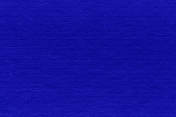 Cardboard blue abstract pattern texture close-up. Retro old paper background. Grunge concrete wall. Vintage blank wallpaper.