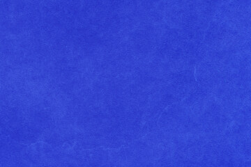 Cardboard blue abstract pattern texture close-up. Retro old paper background. Grunge concrete wall. Vintage blank wallpaper.