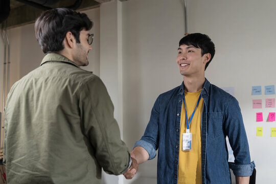 Two man shaking hands after a interview.