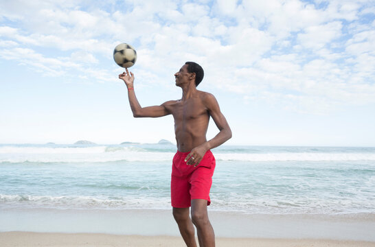 Brazilian man with soccer ball. Ipanema Beach. Rio de Janeiro.