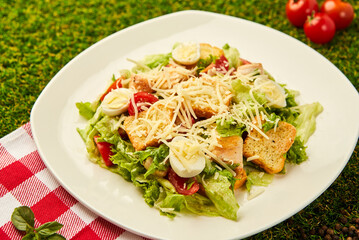 Delicious caesar salad with parmesan cheese, homemade croutons and dressing.
