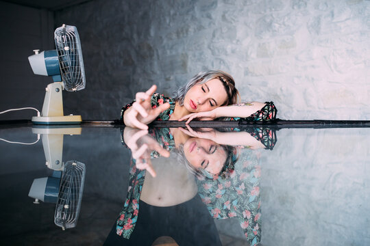 woman on a reflecting glass