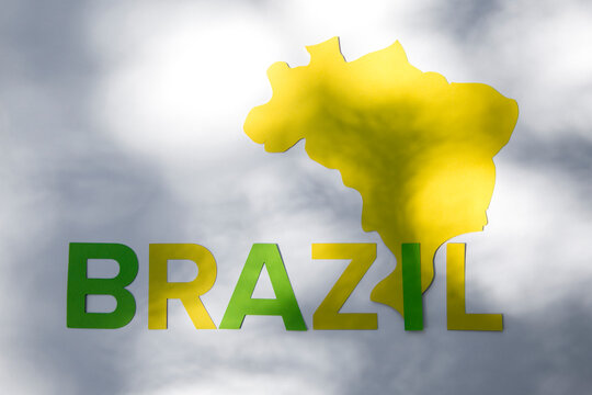 Country's shape and Brazil's name in letters in light and shadow