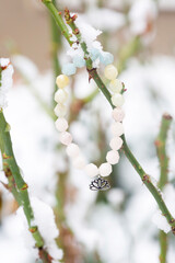 Mineral stone bracelet on snow background