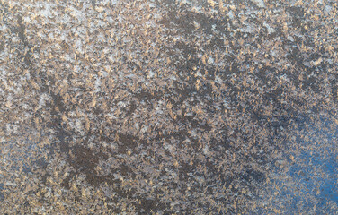 The texture of frozen frost on the glass