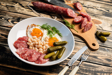 breakfast with egg, sausage and beans