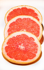Naklejka na ściany i meble Grapefruit slices isolated on white background, top view.