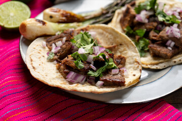 Grilled beef steak tacos on wooden background. Mexican food