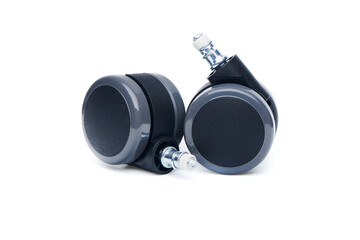 Two furniture castor wheel for office chair isolated on white background. Close-up view