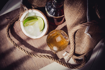 rum with ice and lime in a coconut glass