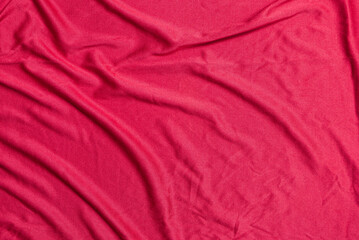 Fototapeta na wymiar red silk sheet with creases