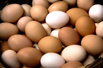 fresh eggs for sale in a market, basket of eggs close up view