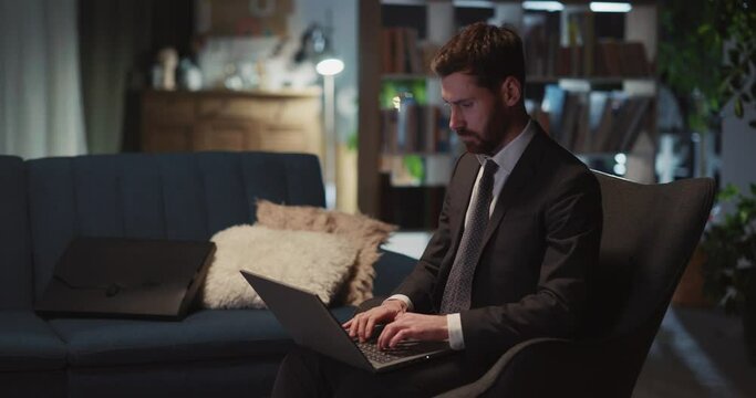 Businessman sitting in chair finally finishing computer project with laptop imeddiately falling asleep in chair. Overworking kills. Concept of workaholic.