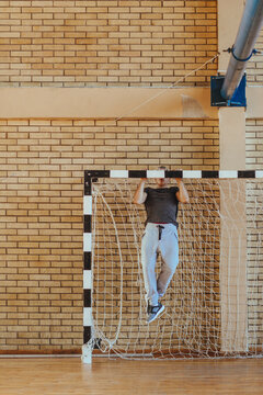 High Schooler Doing Pull Ups