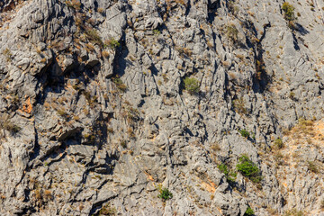 Natural texture of a mountain cliff rock for background