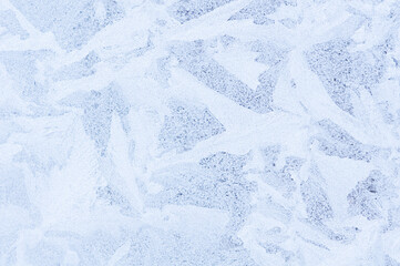 Fototapeta premium Abstract icy white pattern on frozen glass as a background image. Space for text