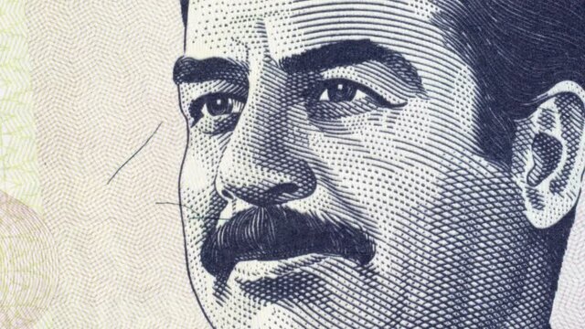 Saddam Hussein on Iraq 100 dinar (2002) banknote rotating. Former president of Iraq