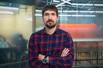 Portrait of a young businessman working in a coworking office. Consulting, training, business. Business startup and entrepreneurship concept