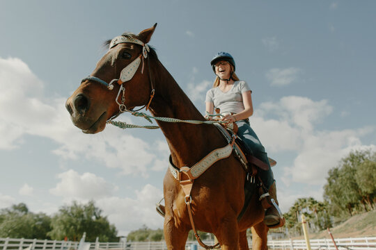 Girl on her horse Laughing
