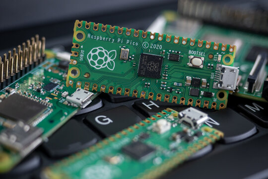 Galati, ROMANIA - February 09, 2021: Close-up of Raspberry Pi Pico, Raspberry Pi 4b and Raspberry Pi Zero W on a laptop keyboard.