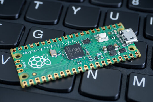 Galati, ROMANIA - February 09, 2021: Close-up of Raspberry Pi Pico, Raspberry Pi 4b and Raspberry Pi Zero W on a laptop keyboard.