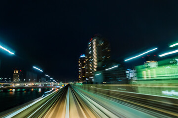 Speed and motion - driving into big city at night