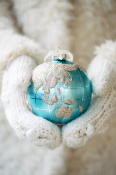 Hands holding Christmas ornament