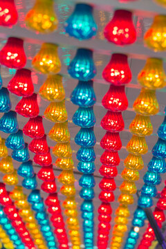 Fairground lights under a canopy