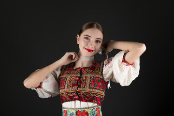 Young beautiful slovak woman in traditional dress. Slovak folklore