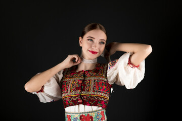 Young beautiful slovak woman in traditional dress. Slovak folklore