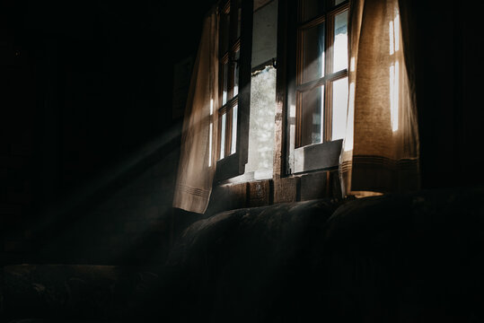 Light rays shining through a wood window frame