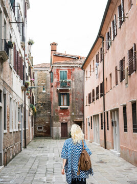 Woman walking on streets of old city