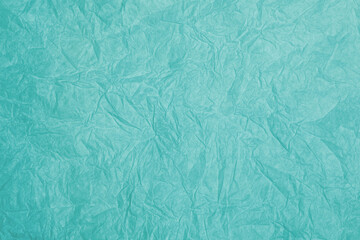 Old crumpled turquoise paper background texture