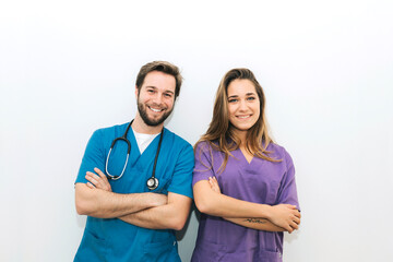 Happy veterinarians posing and looking at camera
